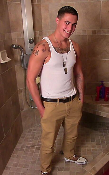 Muscular Grant shows a well-build body in bathroom