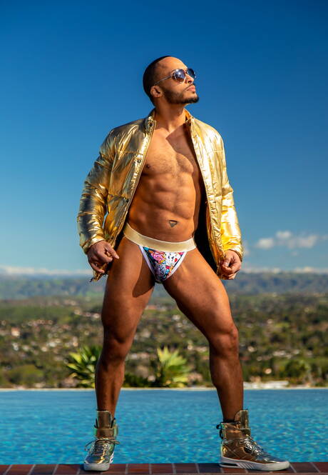 Ebony well-built Dillon Diaz posing nude and showing nice butt at the pool