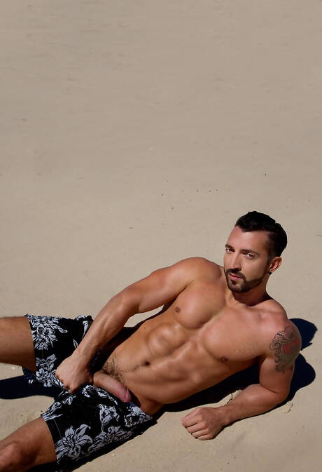 Latino stud Jimmy Durano and american strongman Ricky Roman in hot homosexual action on beach