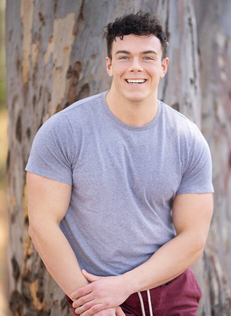 American bodybuilder Clark Reid shows a husky body outside