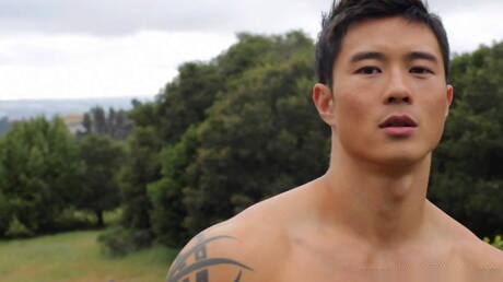 Oriental bull Peter Le undressing and showing tight butt outdoor