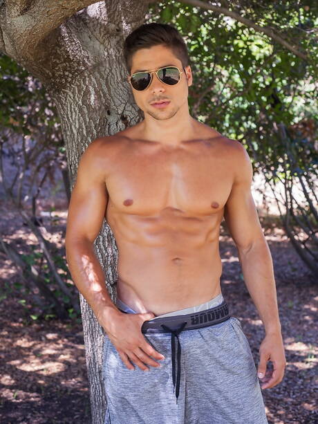 Italian muscular Fabio Acconi having a pleasure outdoor